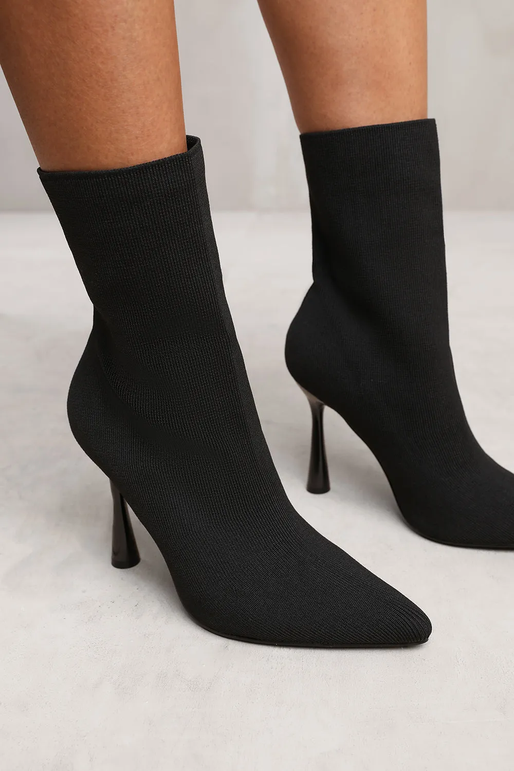 NEVAEH ANKLE SOCK BOOT IN BLACK KNIT